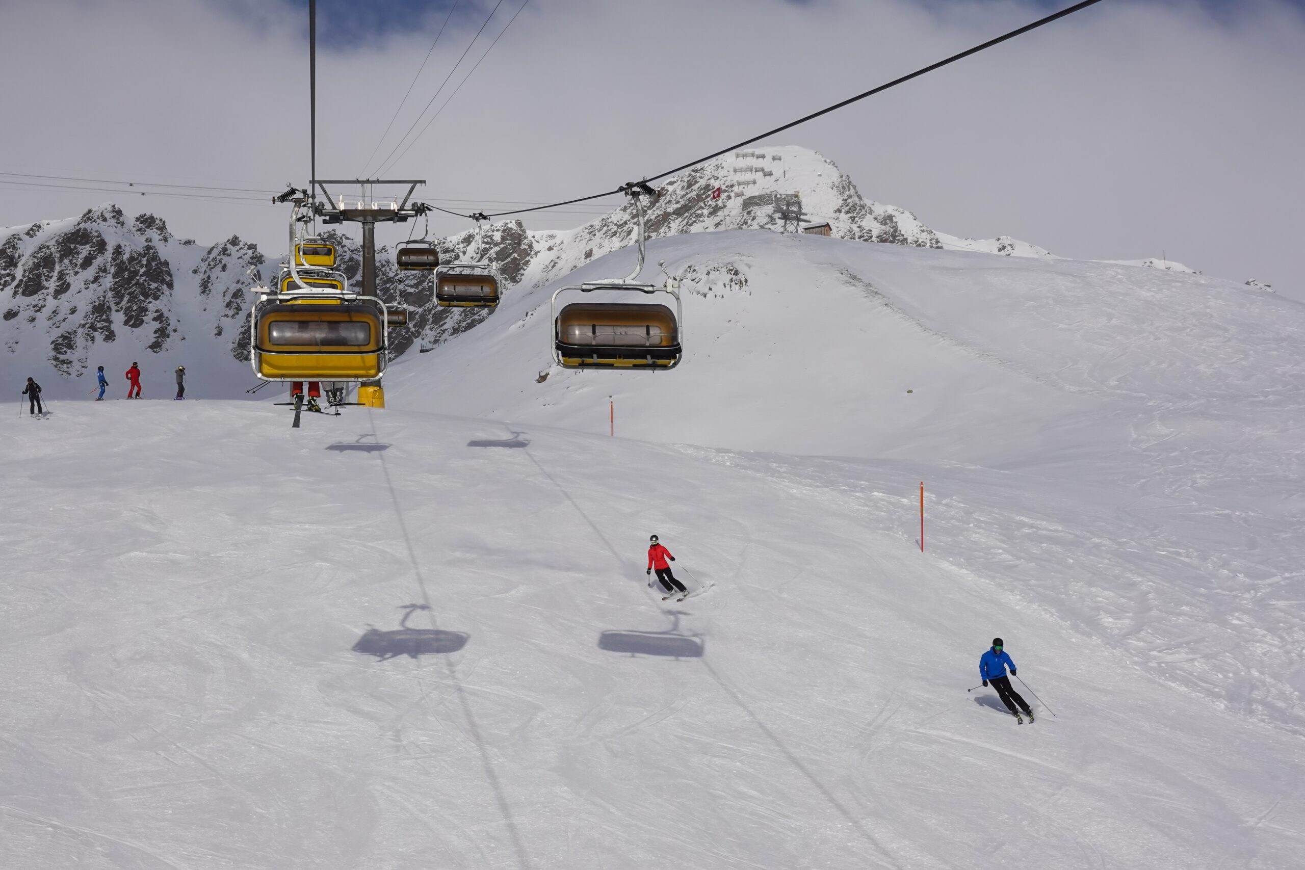 Skiers,And,Chair,Lift,In,The,Saint,Moritz,Ski,Resort
